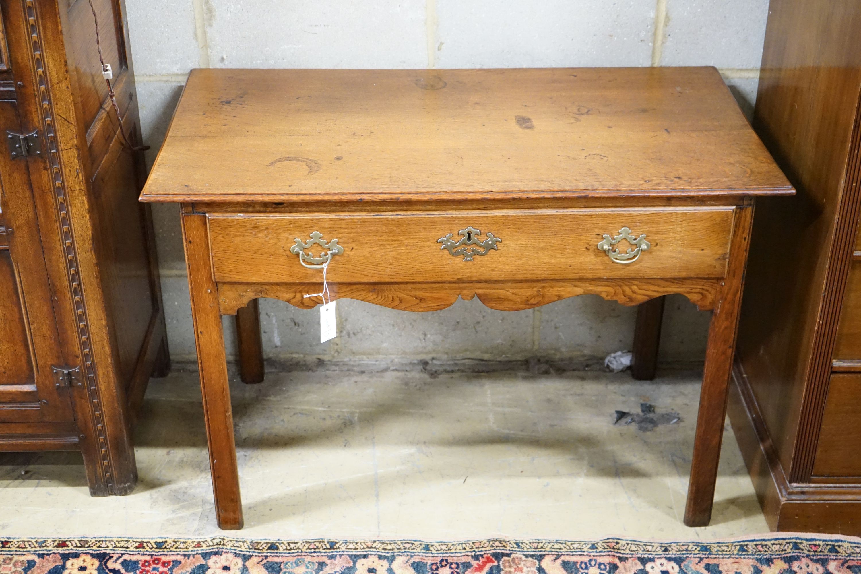 A George III oak side table, width 106cm, depth 57cm, height 72cm